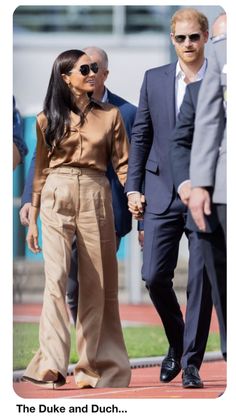 prince harry and his wife, the duke and dutch royal family are seen walking hand in hand