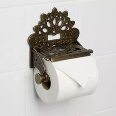 a roll of toilet paper sitting on top of a metal holder