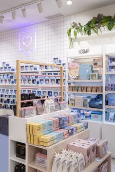 a store with shelves filled with items and boxes on display in front of the counter