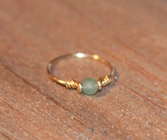 My green aventurine stone thin ring is hand formed by me and made to order in your specified size. An aventurine 3mm stone is placed in this ring, but check out my shop as I make this ring with other semi precious stones too. Pick your wire as your ring can either be made with silver tone, gold tone, Solid Sterling or 14k Gold Filled. It is made in the following sizes: 2.5 - 12 Aventurine Ring, Gold Wrap Ring, Wire Wrapped Jewelry Pendant, Wire Wrap Ring, Rings Green, Wire Jewelry Rings, Diy Jewelry Rings, Wire Wrapped Jewelry Diy, Ring Wire