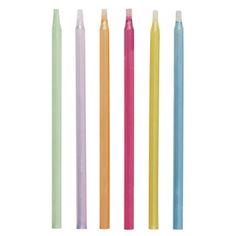 four different colored candles are lined up in a row