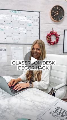 a woman sitting at a desk with a laptop computer in front of her and the words class comdesk decor hack