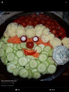 a platter filled with cauliflower, carrots and other vegetables