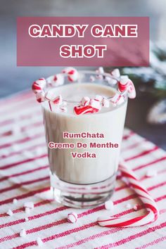 A festive Candy Cane Shot with a candy cane garnish and a red swirl. Candy Cane Shooters, Christmas Shooter Ideas, Candy Cane Shots Recipe, Candy Cane Shot Glasses, Christmas Party Shots Holiday Drinks, Alcoholic Christmas Drinks For A Party, Peppermint Shots Recipe, Candy Cane Jello Shots, Christmas Shots For Adults