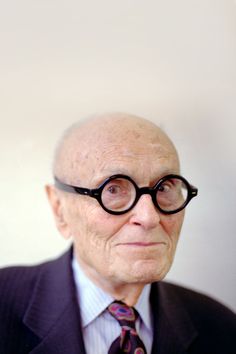 an old man wearing glasses with a quote on the side that says, a glass frame tribute to philip johnson