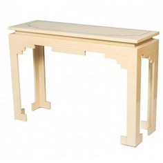 a white table with a bench on it's legs and an open drawer at the top