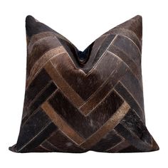 a brown and black pillow on a white background