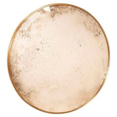 a round gold plate with white speckles on the edges and bottom, isolated against a white background