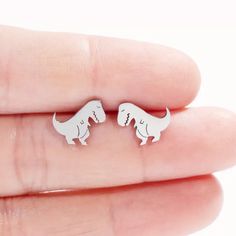 Fashion Gets Fierce And Ferocious With These Fun T-Rex Sterling Silver Stud Earrings. New! Boutique Earrings From Joy Co. Jewelry Dainty T Rex Studded Earrings Simple. Minimalist. Bohemian. Stainless Steel Silver Color I Sell These In Gold Color Too! Shop My Closet And Bundle Dino, Dinosaur, Dinosaurs, Tyrannosaurus Rex Boutique Earrings, Trex Dinosaur, Minimalist Bohemian, Studded Earrings, Simple Stud Earrings, Jewelry Dainty, Sterling Silver Stud Earrings, Earrings Simple, Tyrannosaurus Rex