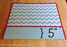 the area rug is on top of the wooden floor and has numbers 5 - 6 in it