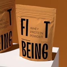 two bags of protein powder sitting on top of a counter next to each other with the words, fit being printed on them