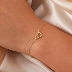 Tiny Knot Bracelet, 14K Solid Gold Heart Knot Bracelet, Dainty initial Unique Love Bracelet, Handmade 14K Gold Knot Bracelet, Great Gift For Her, Summer Jewelry, Anniversary Bracelet, Birthday Gift, Christmas Gift, Solid Gold Bracelet, Minimalist Gold Bracelet, Wedding Bracelet, Valentine's Day Gift "Material: SOLİD GOLD (No Gold Filled Or No Gold Plated)" "KARAT: 14K (585) "Bracelet Length: 11 MM "Bracelet Width: 7,5 MM "Available Gold Color: (Yellow Gold, White Gold, Rose Gold) "The certificat Elegant Initials Charm Bracelet For Anniversary, Elegant Charm Bracelet With Initials For Anniversary, Elegant Open Heart Bracelets, Elegant Open Heart Bracelets For Everyday, Elegant Yellow Gold Open Heart Bracelet, Dainty Formal Bracelets With Heart Charm, Formal Dainty Bracelets With Heart Charm, Elegant Infinity Heart Bracelet As Gift, Dainty Formal Bracelet With Heart Charm