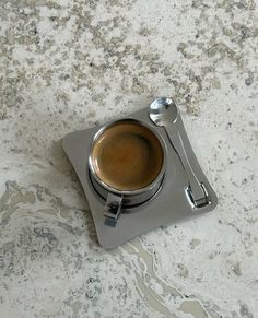 a cup of coffee sitting on top of a saucer