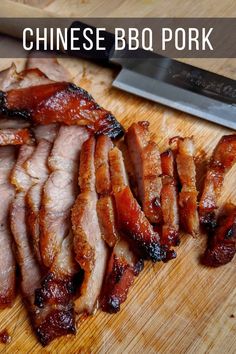 sliced bacon sitting on top of a cutting board with a knife next to it's blade