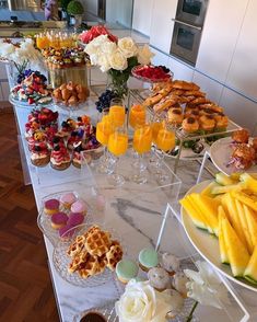 a buffet table filled with different types of food and drinks on it's sides