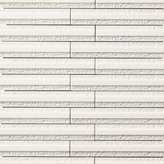 a white brick wall that is made out of concrete blocks and has some lines drawn on it