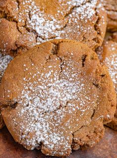 several cookies with powdered sugar on them