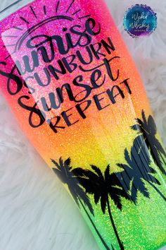 this tumble cup is painted with glitter and has palm trees on the side that reads sunrise sunset sunset reef