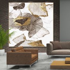 a living room with two couches and a painting on the wall