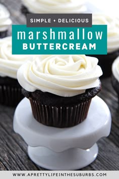 cupcakes with white frosting on top and the words, simple delicious marshmallow buttercream