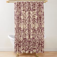 a red and white shower curtain with an ornate design on the bottom, in front of a bathtub