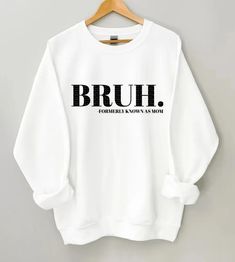 Embrace the mom life with a touch of humor in our 'Bruh, Formally Known as Mom' sweatshirt! This cozy and witty shirt is perfect for the moms who know that parenthood is both an adventure and a source of endless laughter. Crafted with comfort and a hint of sarcasm, this sweatshirt is an ideal addition to your wardrobe for chilly days or relaxed moments. The bold statement in stylish font adds a playful twist to your mom attire, capturing the essence of modern parenting with a dash of cool. Whether you're juggling the demands of motherhood or just love a good laugh about the journey, this sweatshirt is a fun expression of the bruh-mom life. Grab yours now and showcase your mom humor with pride! 😄👕 #MomHumor #BruhMom #CozySweatshirt ♥ Gildan 18000 Crewneck Sweatshirt ♥ Made with 50% COTTON Boy Mom Sweatshirt, Bruh Shirt, Letter Sweater, Mom Of Boys, Boy Mama, Boys Gift, Show White, Mom Era, Color Name