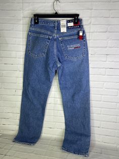 Up for grabs is a brand new VTG Tommy Hilfiger Denim Jeans Blue Classic Fit Straight Leg 90s Y2K Women's Juniors Size 5/28. Never worn or used. Measurements Laying flat are included in photos, PLEASE compare them to your own for proper fit! Please refer to all photos. Ask any questions prior to purchasing. Thanks! Browse my store for other great listings!!! NEW listings added daily!!! PLEASE VIEW PHOTOS VERY CAREFULLY BECAUSE THEY ARE APART OF THE DESCRIPTION AND SHOWS IN GREAT DEPTH THE CORRECT Tommy Hilfiger Casual Jeans For Spring, 90s Blue Jeans With Five Pockets, 90s Style Mid-rise Blue Jeans, 90s Style Blue Mid-rise Jeans, Tommy Hilfiger Blue Denim Bottoms, Fit Y2k, Tommy Hilfiger Jeans, Tommy Jeans, View Photos