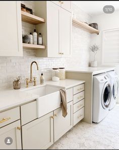 a washer and dryer in a white kitchen