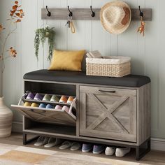 an entryway bench with shoes and baskets on the top, next to a wall mounted coat rack