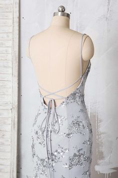 Sophisticated and glamorous, this grey jersey mermaid prom dress is decorated with silver shiny floral sequin appliques. The fitted bodice comes with V-neck and straps low back. This curve-hugging long formal gown is a nice option for special occasion. Sparkly Silver Floral Sequin Gray Sexy Open Back Mermaid Prom Gown. shown color silver bra support with cups boning no closure back zipper lining fully lined Silver Formal Dress Long, Silver Formal Dress, Silver Formal Dresses, Mermaid Prom Gown, Silver Bra, Formal Dress Long, Mermaid Gown Prom, Silver Prom Dress, Matric Dance