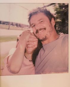 a man and woman are posing for a photo in an old polaroid style frame