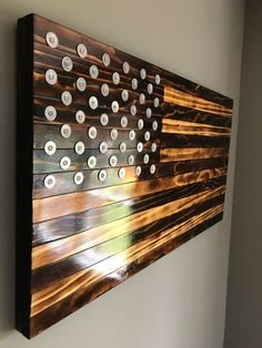 an american flag made out of buttons on a wall