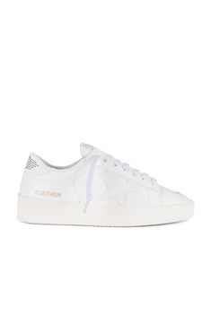 From Italy to the skateparks of Los Angeles, Golden Goose has become a world-renowned high fashion brand for luxury sneakers. Hand crafted on premium Italian leather; Golden Goose has successfully combined the relaxed vintage aesthetic with their unique 'lived in' touch. Their signature pre-scuffed style (each distressed by hand) offers a nonchalant attitude that embodies 'perfect imperfection' for a touch of life, comfort and fashion forward designs.Leather upper with rubber sole.  Made in Ital Golden Goose Stardan, Perfect Imperfection, High Fashion Branding, Golden Goose Deluxe Brand, Luxury Sneakers, Skate Park, Gold Logo, Logo Stamp, Golden Goose