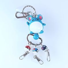 a key chain with a blue and white animal on it