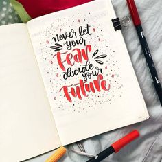 an open notebook with the words never let your fear decide your future