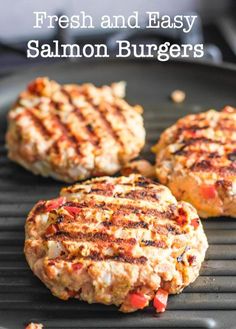 three hamburger patties on a grill with the words fresh and easy salmon burgers