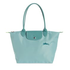 NWT Longchamp Le Pliage Green Medium/Small Shoulder Tote with Long Handles - 100% AUTHENTIC Guaranteed! From a reliable and experienced Top Rated Plus US Seller, 15 years on eBay!     Color: Lagoon (also available in our eBay store many other colors)     Style #: L2605919P65     Brand new in original packaging, MINT condition, never been used!     100% authentic guaranteed! Receipt copy for tote available upon request (after purchase)!     Excellent gift idea! Not too big, not too small, Longcha Long Champ Bag, Longchamp Le Pliage Green, Le Pliage Medium, Longchamp Le Pliage Medium, Longchamp Medium, Longchamp Bag, Parisian Vibes, Longchamp Bags, Luxury Purses