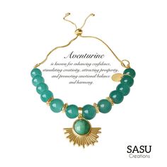 This exquisite bracelet is a bold yet elegant statement piece, crafted with large green aventurine beads known for their smooth, polished surface and soothing color. The beads are accented with intricately designed gold spacers, adding a touch of sophistication and luxury. The centerpiece is a radiant, sunburst-inspired pendant in gold, featuring a matching green aventurine stone for a harmonious and eye-catching design. The adjustable gold-plated chain ensures a comfortable and secure fit, maki Healing Beads, Green Aventurine Stone, Aventurine Stone, Beads Charm, Artisan Gift, Bead Charm Bracelet, Green Aventurine, Bracelet For Women, Adjustable Bracelet