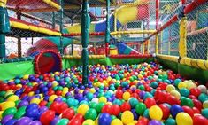 an indoor play area with lots of colorful balls