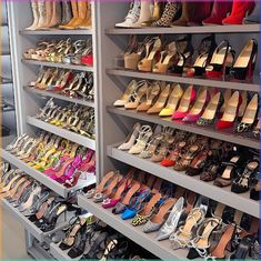 many pairs of women's shoes are on display in a shoe store with shelves full of them