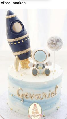 there is a cake that has a rocket on it