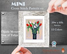 a cross stitch pattern with flowers in a vase