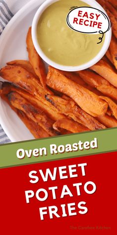 oven roasted sweet potato fries on a white plate with a green dipping sauce in the bowl