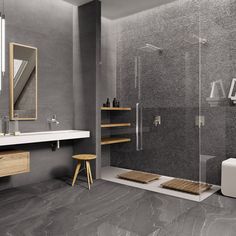 a modern bathroom with grey walls and flooring