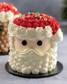 two cakes decorated to look like santa claus