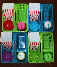 the trays are filled with different types of plastic food and drinkware, including popcorn buckets