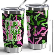 two stainless steel tumblers with pink and green designs on them, one has a straw in it