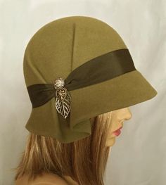 This beautiful ladies cloche is made from fur felt, and hand draped over an antique hat block. Hand finished with authentic millinery techniques, and embellished with grosgrain ribbon, and vintage buttons and toggles (these will vary depending on supply). Please indicate your head size measurement Cloche Hats For Women, Wool Hats For Women, Pola Topi, Antique Hat, Wool Cloche Hat, Sewing Hats, Cloche Hats, Hat Brooch, Handmade Hats