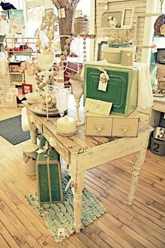 a room filled with lots of different types of furniture and decor on top of wooden floors