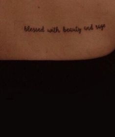 the back of a woman's stomach with an inscription on it that says, be loved